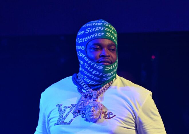 BossMan Dlow Freaks Out Over Leaked Photo Showing Him Covered Only By Luggage